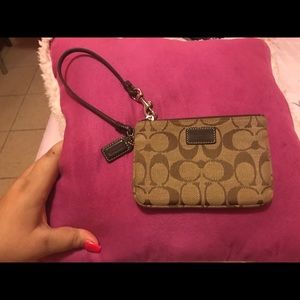 Coach wristlet. I never used it. No tag